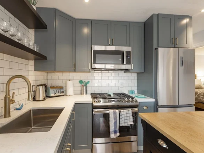 Remodeled kitchen with gray cabinets