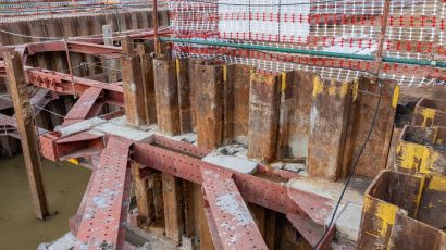 Seismic retrofitting solution using sheet pile walls to prevent soil movement and foundation instability