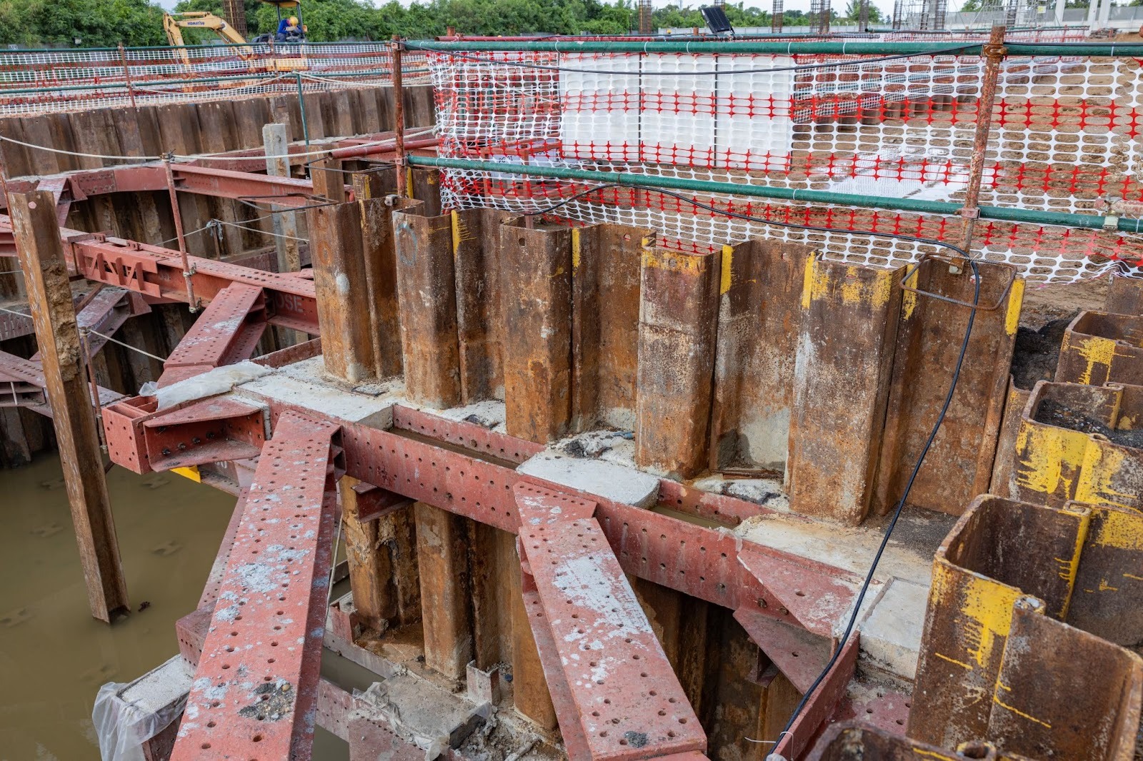 Seismic retrofitting solution using sheet pile walls to prevent soil movement and foundation instability