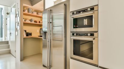 Newly remodeled kitchen featuring built-in appliances and a walk-in pantry