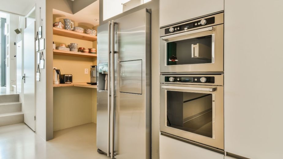Newly remodeled kitchen featuring built-in appliances and a walk-in pantry