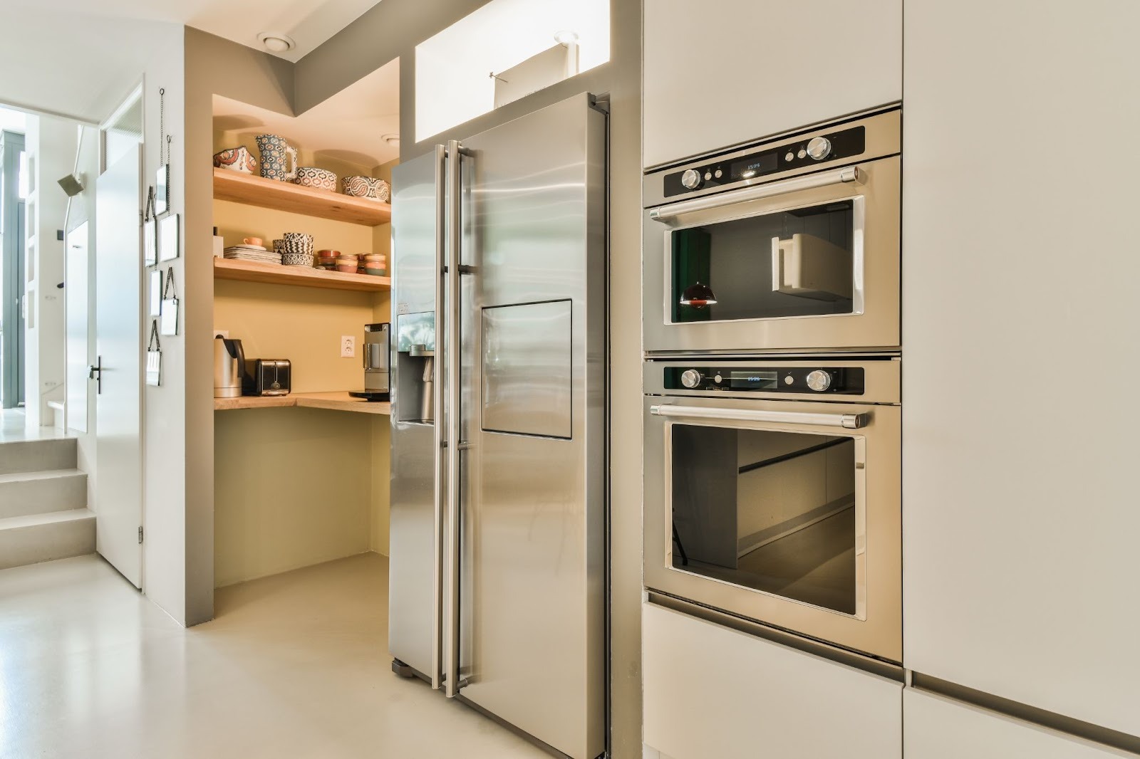 Newly remodeled kitchen featuring built-in appliances and a walk-in pantry
