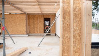 Wood framing in progress for ADU construction on a residential property site