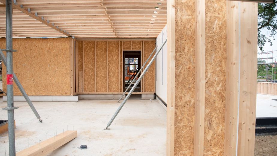 Wood framing in progress for ADU construction on a residential property site