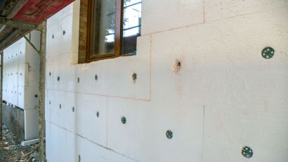 Residential wall showing seismic retrofit reinforcement points, and marked upgrade areas for earthquake protection