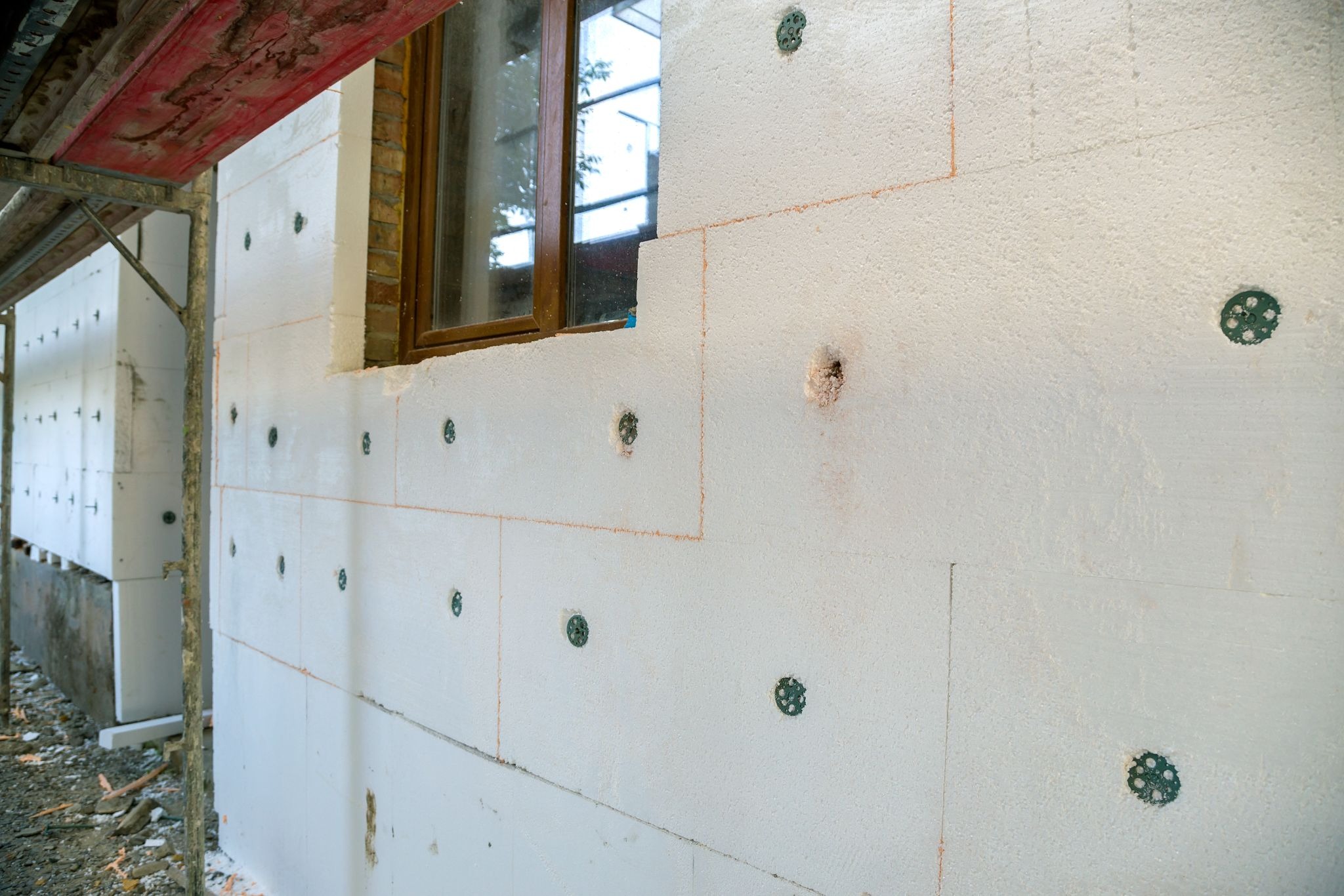 Residential wall showing seismic retrofit reinforcement points, and marked upgrade areas for earthquake protection