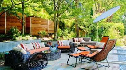 Elegant outdoor patio lounge area featuring comfortable seating, stylish furnishings, and a welcoming atmosphere