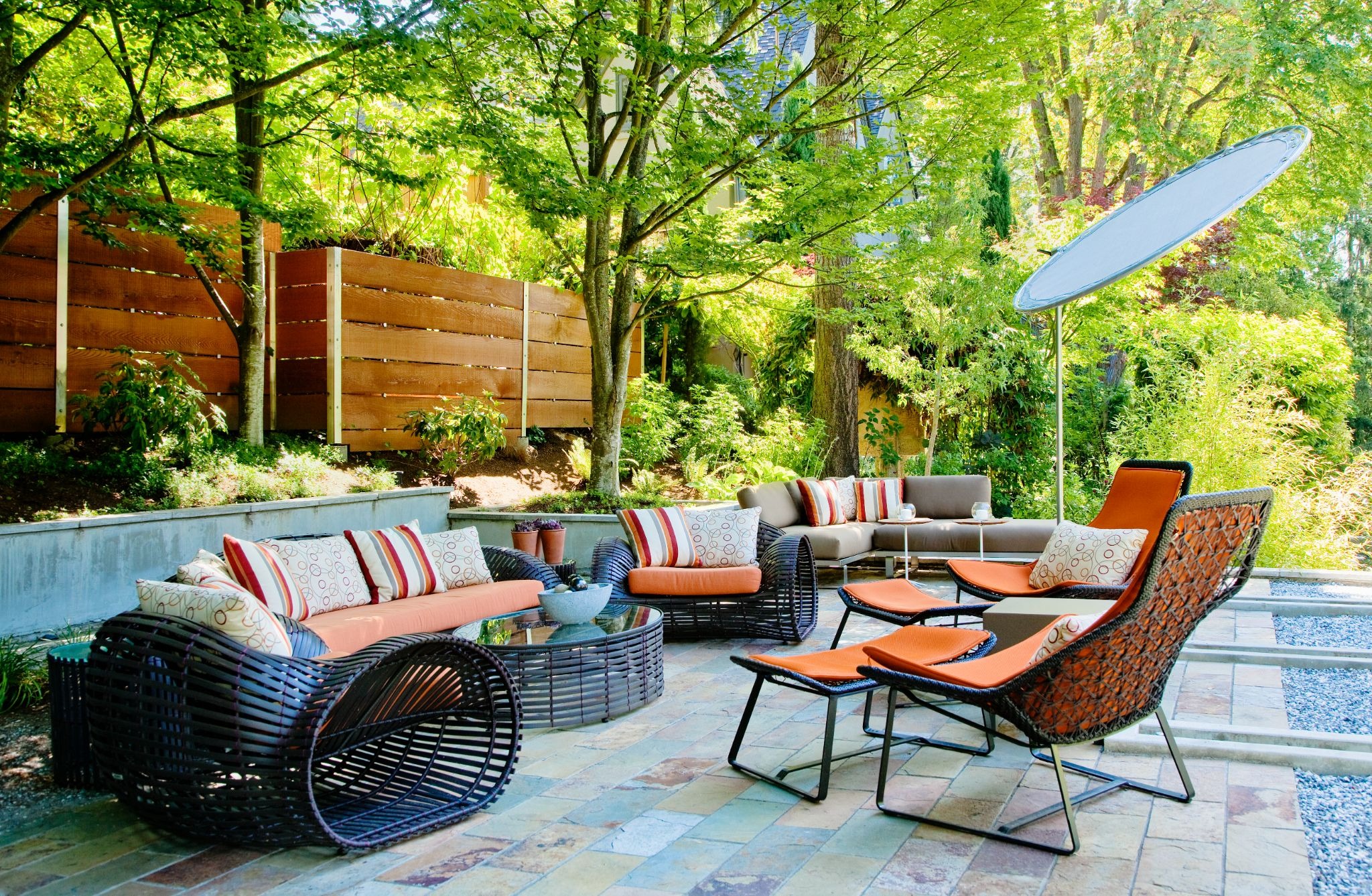 Elegant outdoor patio lounge area featuring comfortable seating, stylish furnishings, and a welcoming atmosphere